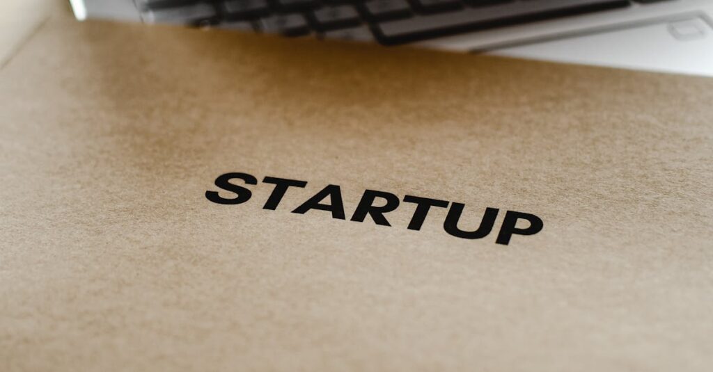 Close-up of a startup folder and laptop, representing business and technology innovation.